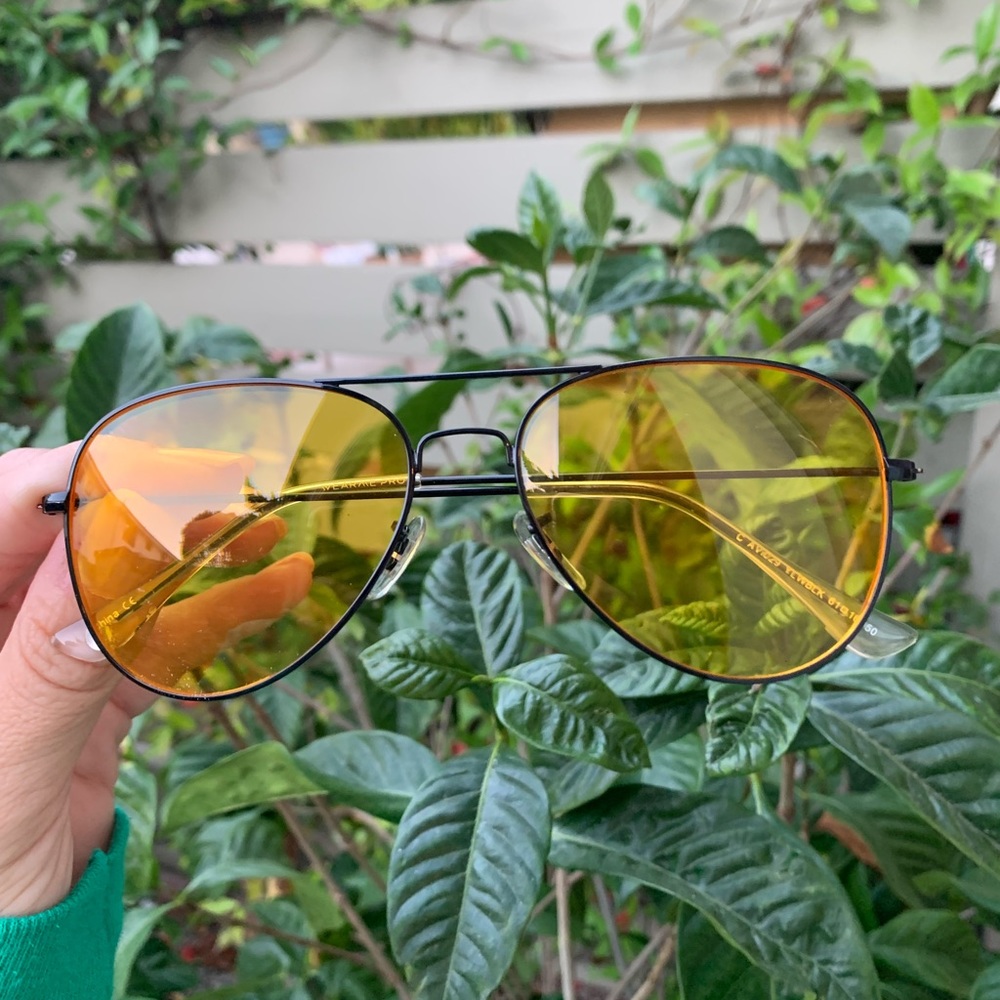 Black rimed aviator style glasses